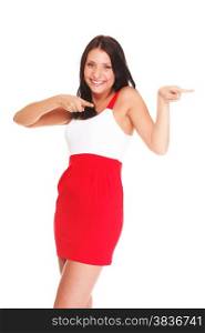 Sexy latin in short red hot dress isolated white playful young woman pointing sideways with both hands