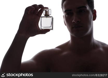 Sexy man with bottle of perfume