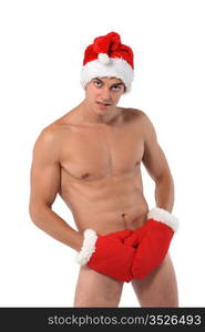 Sexy muscular man wearing a Santa Claus hat isolated on white