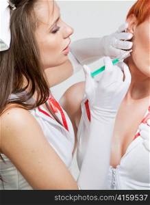 Sexy nurse making an injection