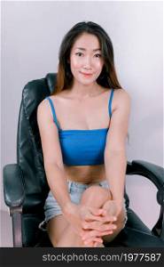 Sexy office asian woman sitting on chairs working