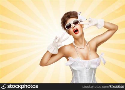 Sexy pinup bride in a vintage wedding corset showing V sign on colorful abstract cartoon style background.
