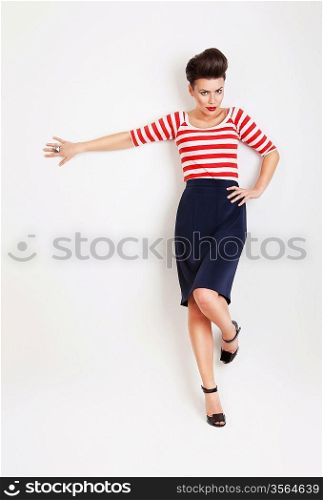 sexy pinup woman in striped t-shirt at wall