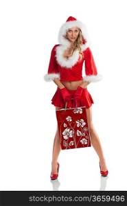 sexy santa claus girl in red costume with skirt and high heel showing a big shopping bag