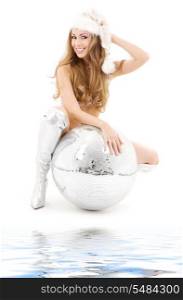 sexy santa helper with big disco ball over white