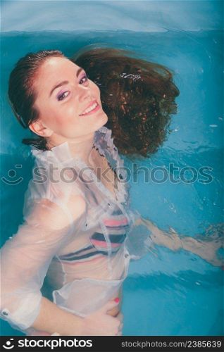 Sexy seductive woman in swimming pool water. Pretty alluring young girl.. Sexy seductive woman in water.