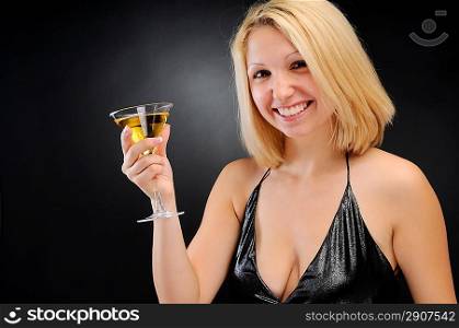 Sexy smiling blonde standing with goblet