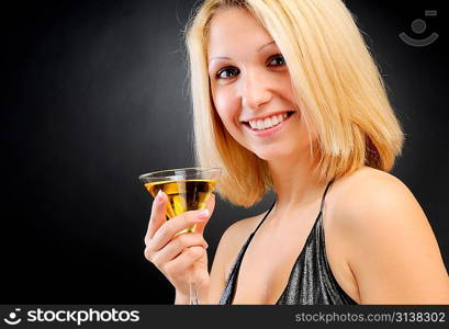 Sexy smiling blonde standing with goblet