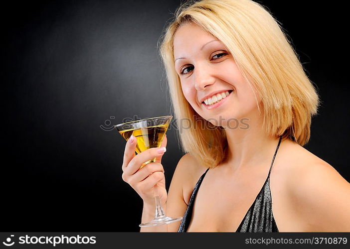 Sexy smiling blonde standing with goblet