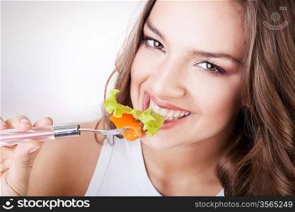 sexy smiling woman eating salad