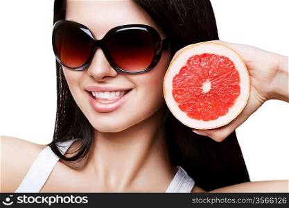 sexy smiling woman with grapefruit in sundlasses on white background