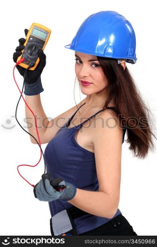 Sexy tradeswoman holding a multimeter