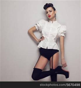 Sexy trendy model posing in vintage shirt, black lingerie, high heels