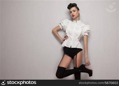 Sexy trendy model posing in vintage shirt, black lingerie, high heels