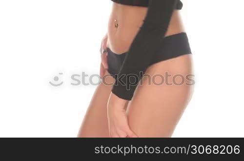 sexy woman back wearing fitness pants dancing on white