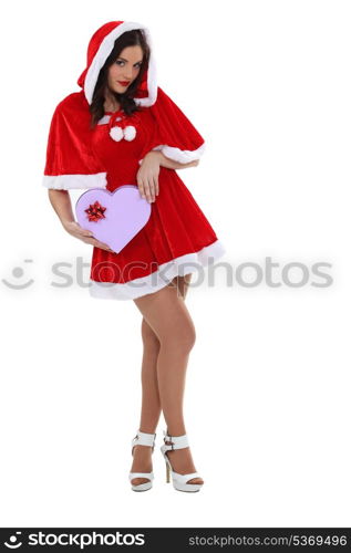 Sexy woman dressed as Mrs Claus with a heart-shaped box