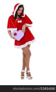 Sexy woman dressed as Mrs Claus with a heart-shaped box
