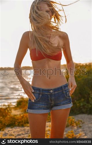 Sexy woman enjoy sun and wind on summer beach, vacation freedom concept, retro color image. Sexy woman enjoy sun and wind on summer beach, vacation freedom concept