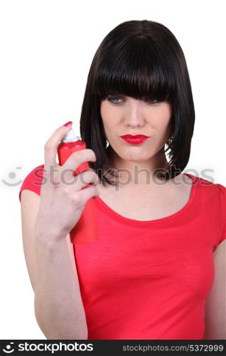sexy woman holding a body spray