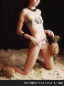 Sexy woman holding a pineapple.