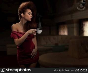Sexy woman holding cup of tea