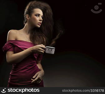 Sexy woman holding cup of tea