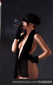 sexy woman in black astrakhan smoking cigar