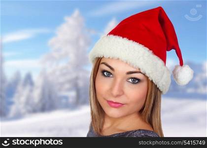 Sexy woman in Christmas with a snow landscape of background