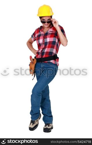 sexy woman in craftsman overalls wearing sunglasses