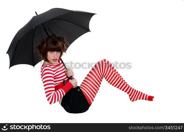 sexy woman in striped stockings holding umbrella