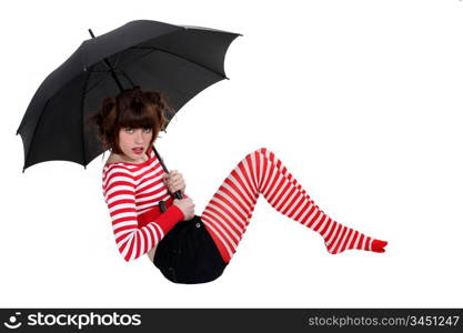 sexy woman in striped stockings holding umbrella