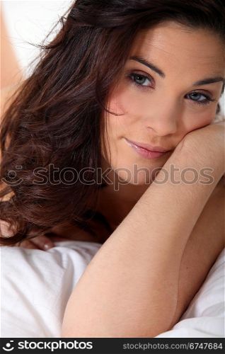 sexy woman lying in her bed