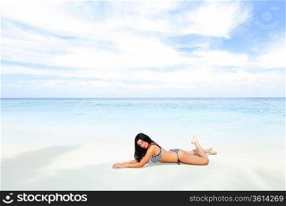 Sexy woman lying on the beach
