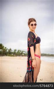 Sexy woman on the beach wearing bikini swimsuit