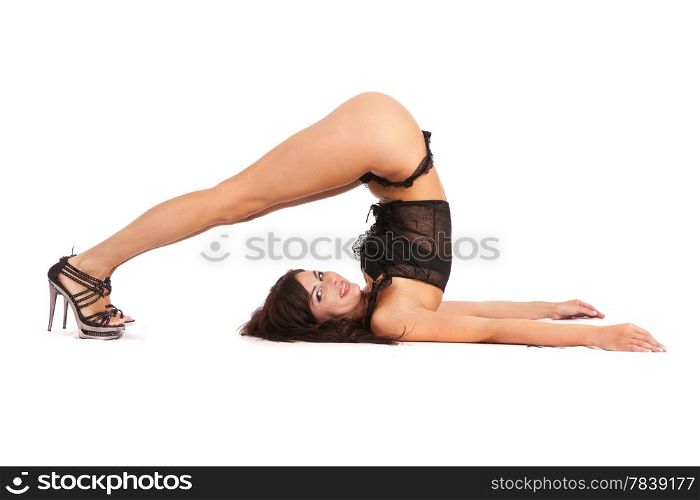 Sexy woman practicing yoga. Wears beautiful shoes isolated on a white background