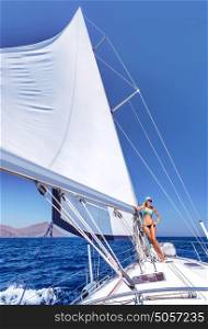 Sexy woman relaxing on sailboat, beautiful sexy model posing on luxury water transport, active summer holidays, enjoyment and pleasure concept