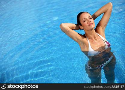 Sexy woman swimming in a pool