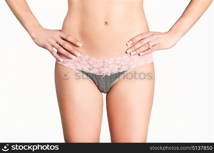 Sexy woman wearing pink panties with bow front view on white background