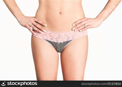 Sexy woman wearing pink panties with bow front view on white background