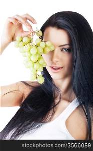 sexy woman with grape before eye on white background
