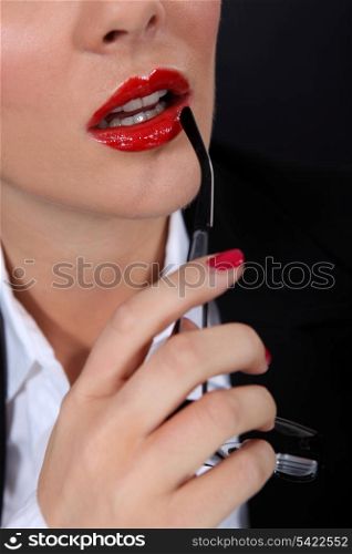 Sexy woman with red glossy lipstick