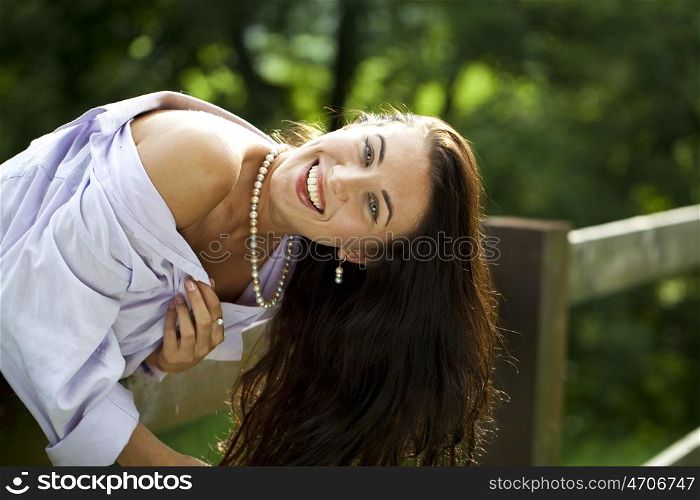Sexy young Brunette in a summer park