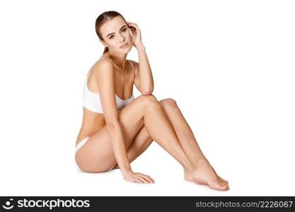 Sexy young girl in white lingerie on a white background. Sexy young girl in white lingerie