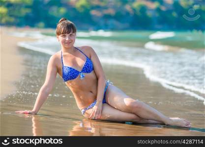 sexy young girl posing on the beach