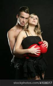 Sexy young male boxer with blond beautiful girl, isolated on black studio shot