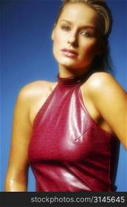 Sexy young model wearing a shiny red top.