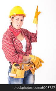 Sexy young woman construction worker, holding a white board