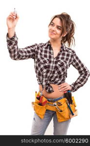 Sexy young woman construction worker writing with a marker over glass