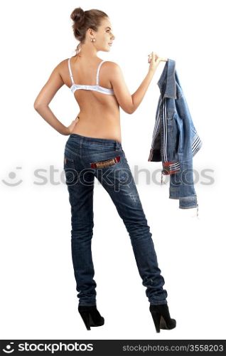 Sexy young woman in a denim suit. Isolated