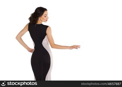 Sexy young woman in long evening dress, isolated on white
